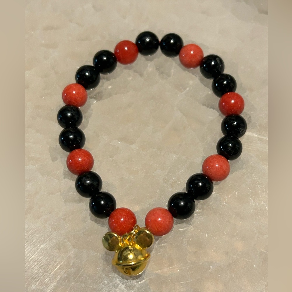 Black obsidian red chalcedony and mickey charm